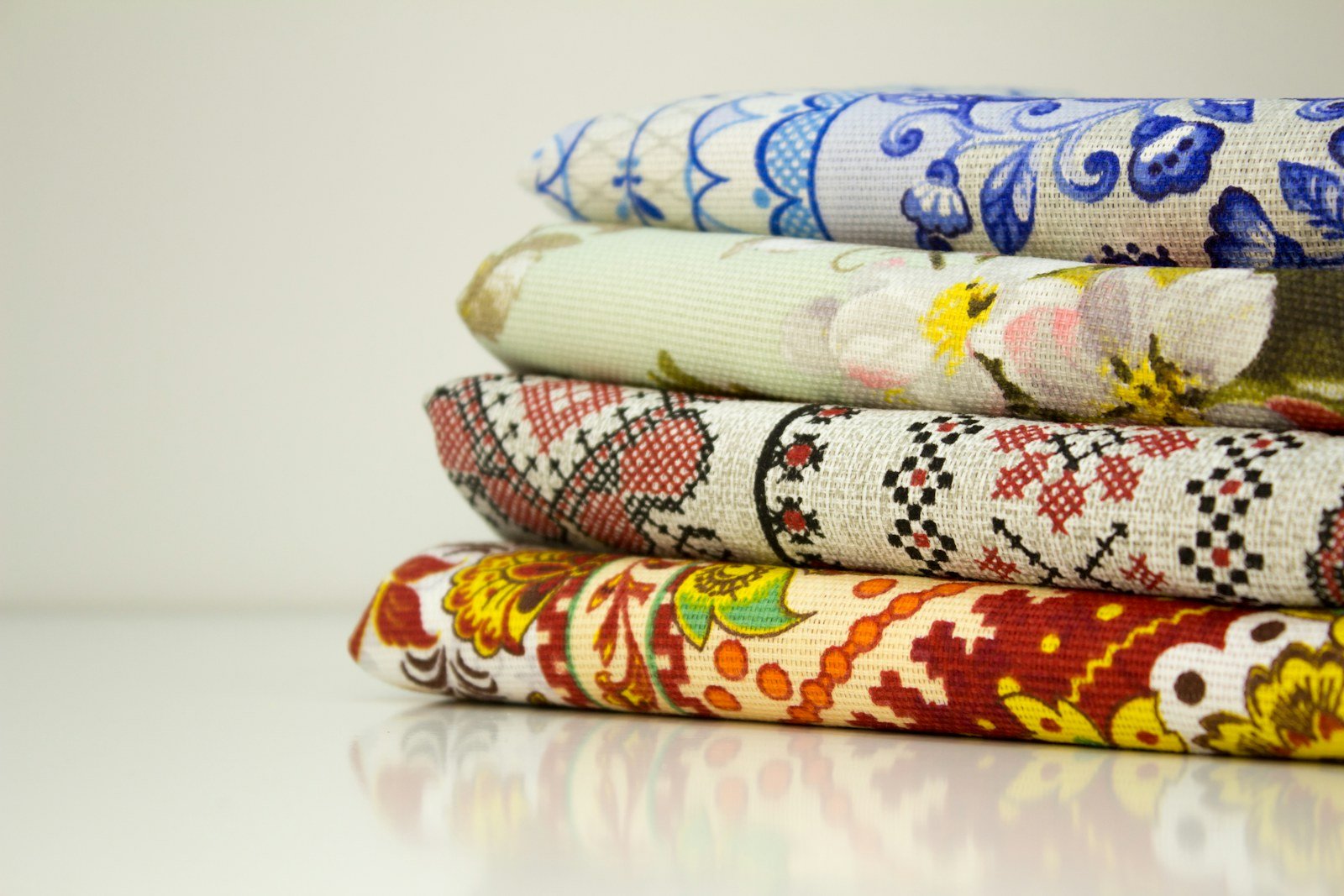Folded printed fabrics stacked neatly