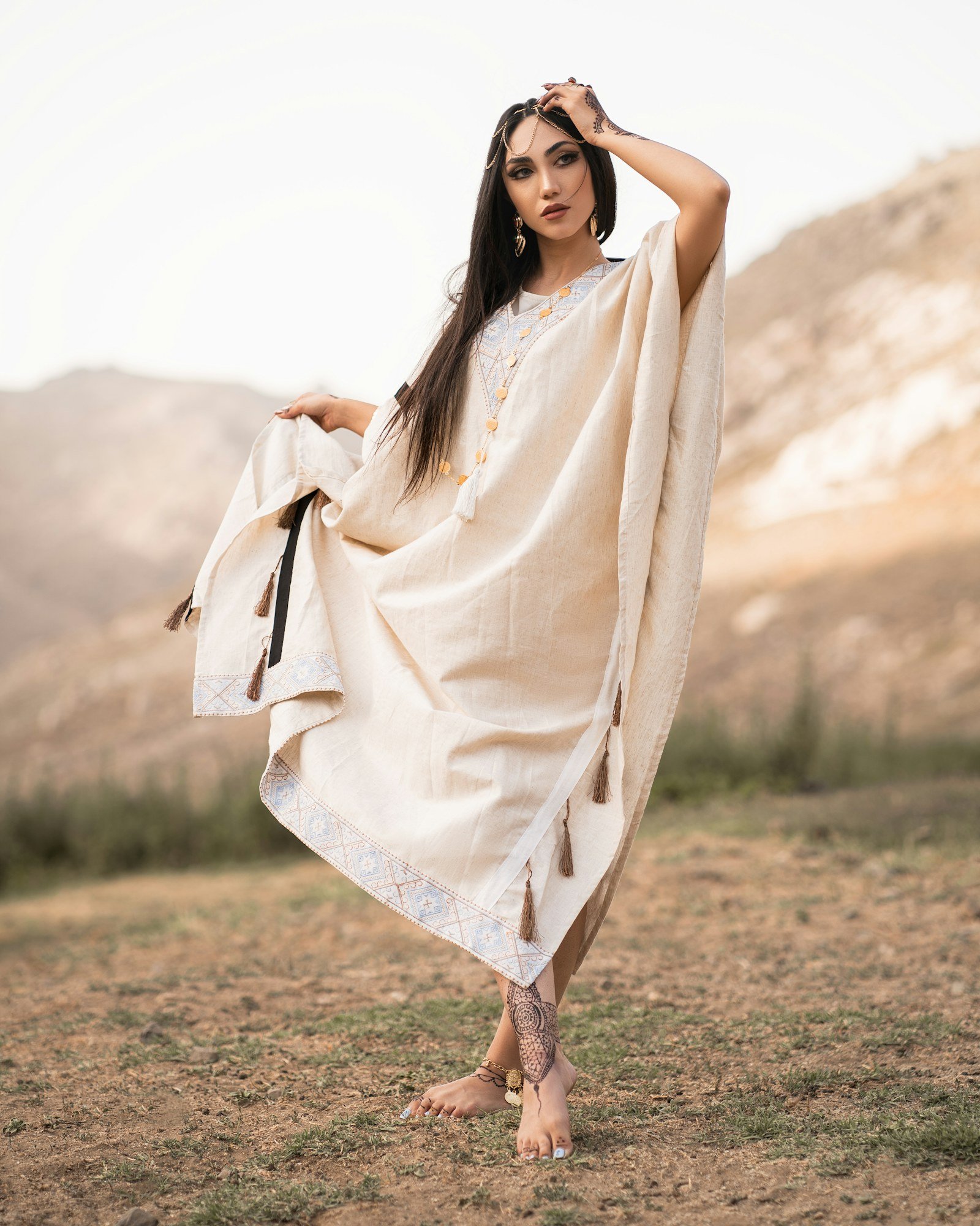 Woman in a cream flowy kaftan outdoors