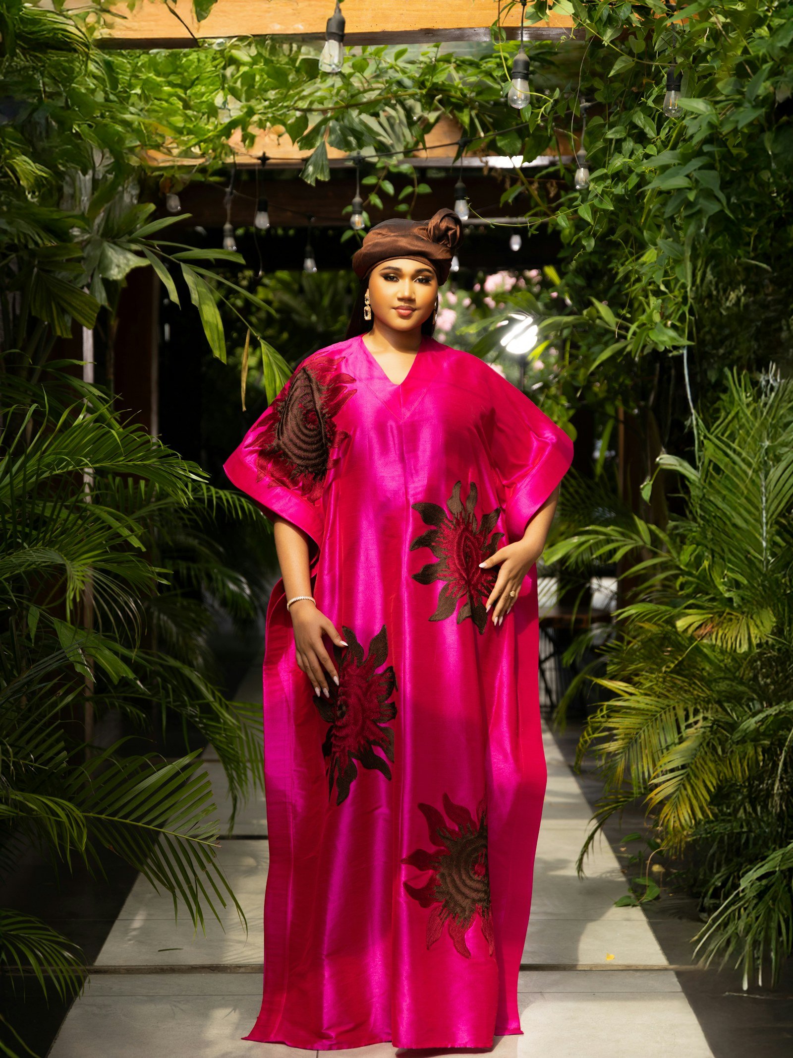 Woman wearing a flowing pink printed kaftan